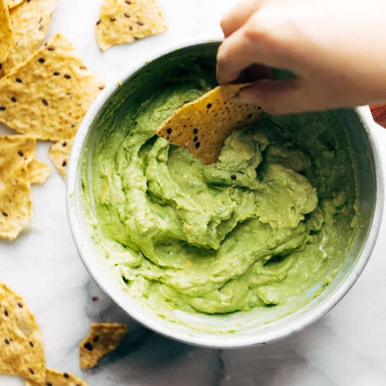 Creamy avocado dip in a bowl.
