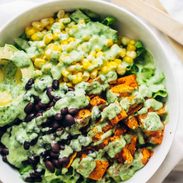 Spicy Southwestern Salad in a serving bowl with avocado dressing.