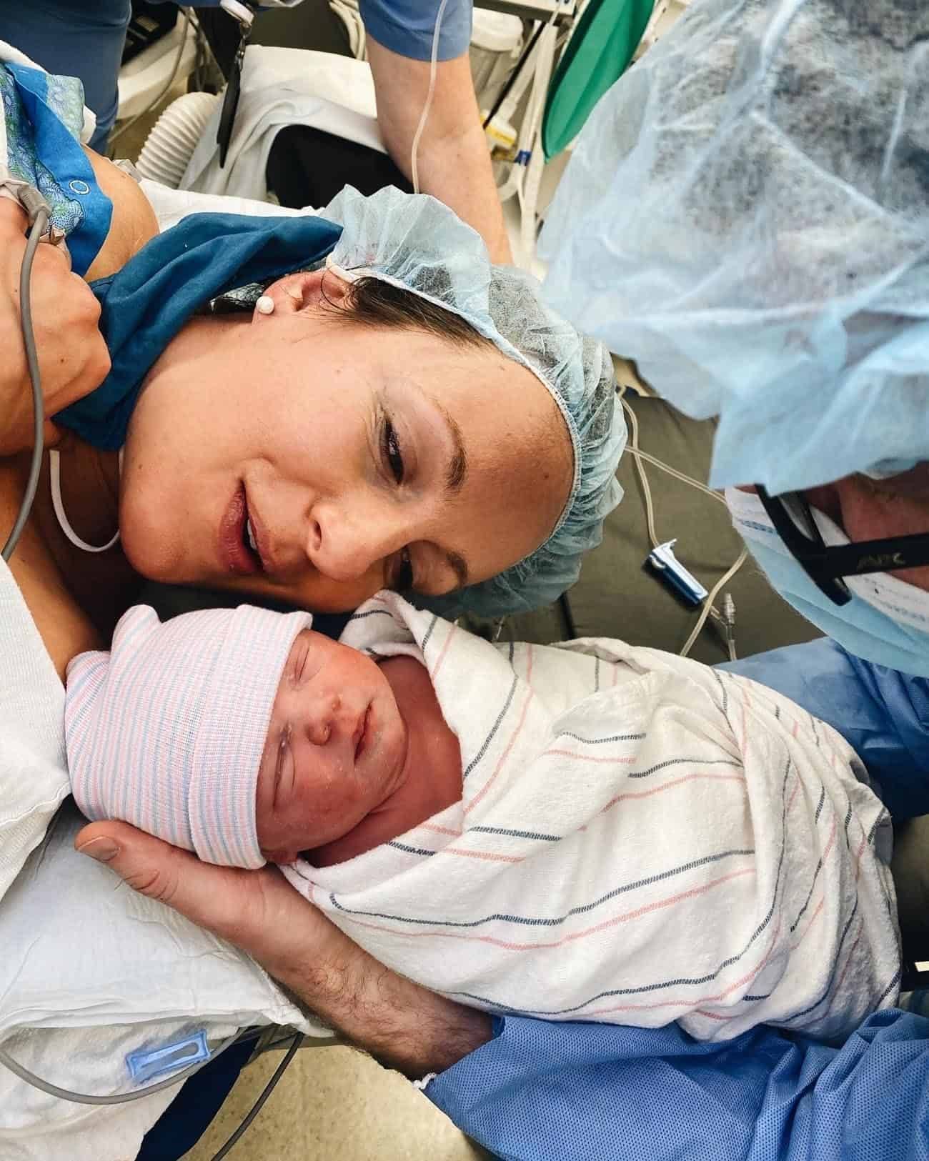 Lindsay in the hospital talking to new baby after birth.