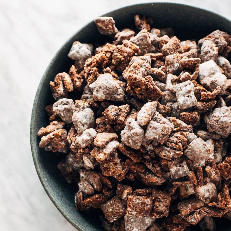 Puppy chow piled in a bowl.