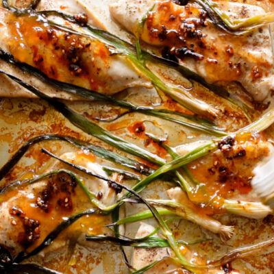 A picture of Sesame Apricot Chicken with Charred Scallions